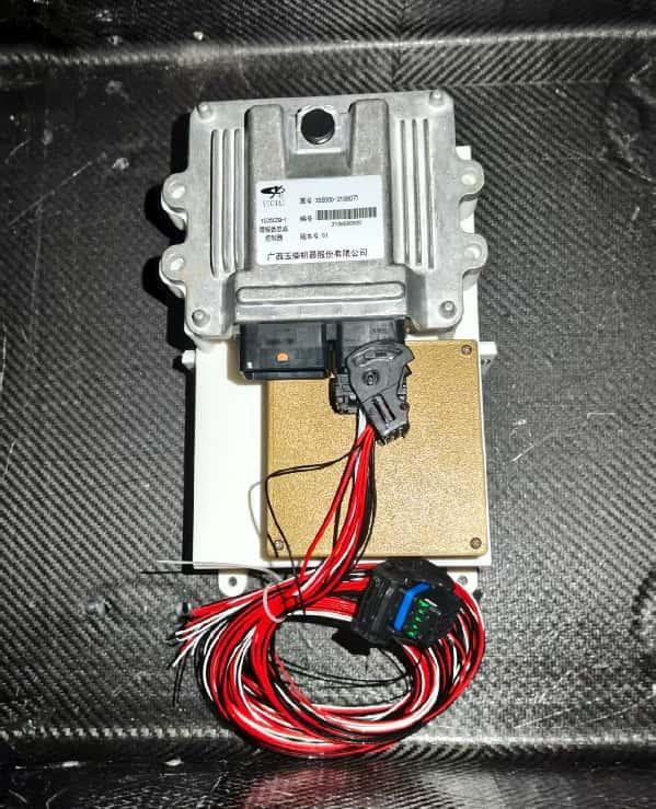 Final Formula SAE VCU and low-voltage module installed with the harness routed below