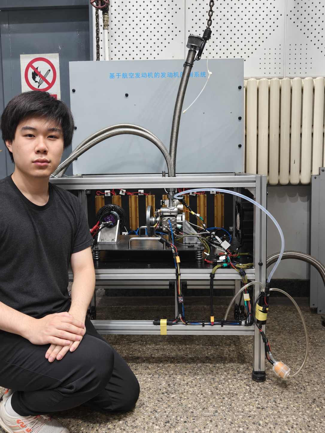 Robin Gong beside the ammonia engine test bench