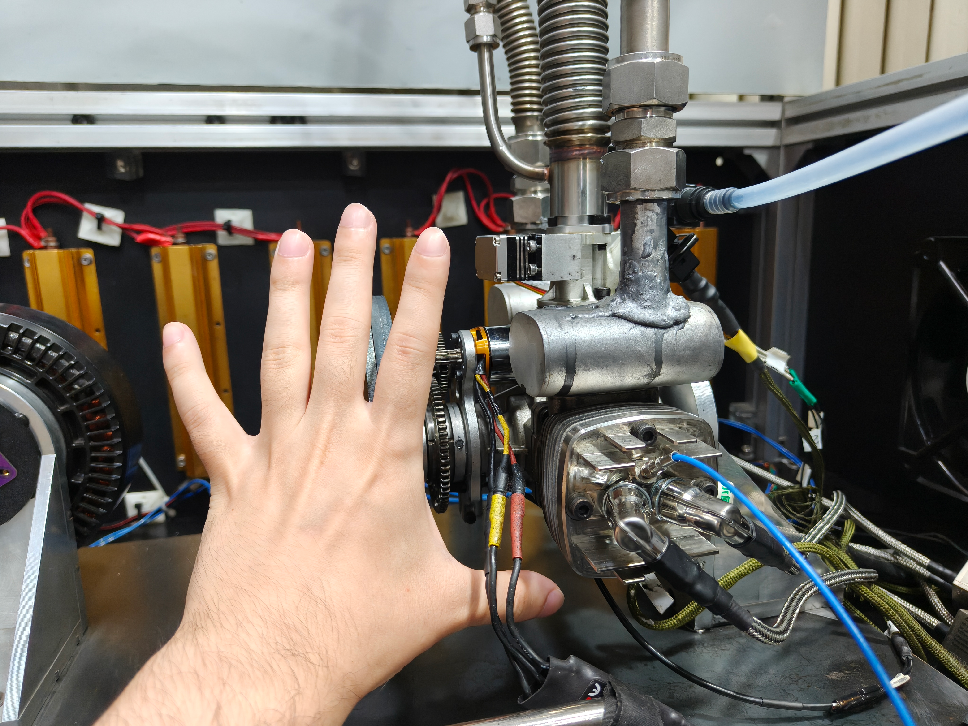 GTT70 engine mounted on the test bench with the exhaust, intake, fuel, and measurement connections visible